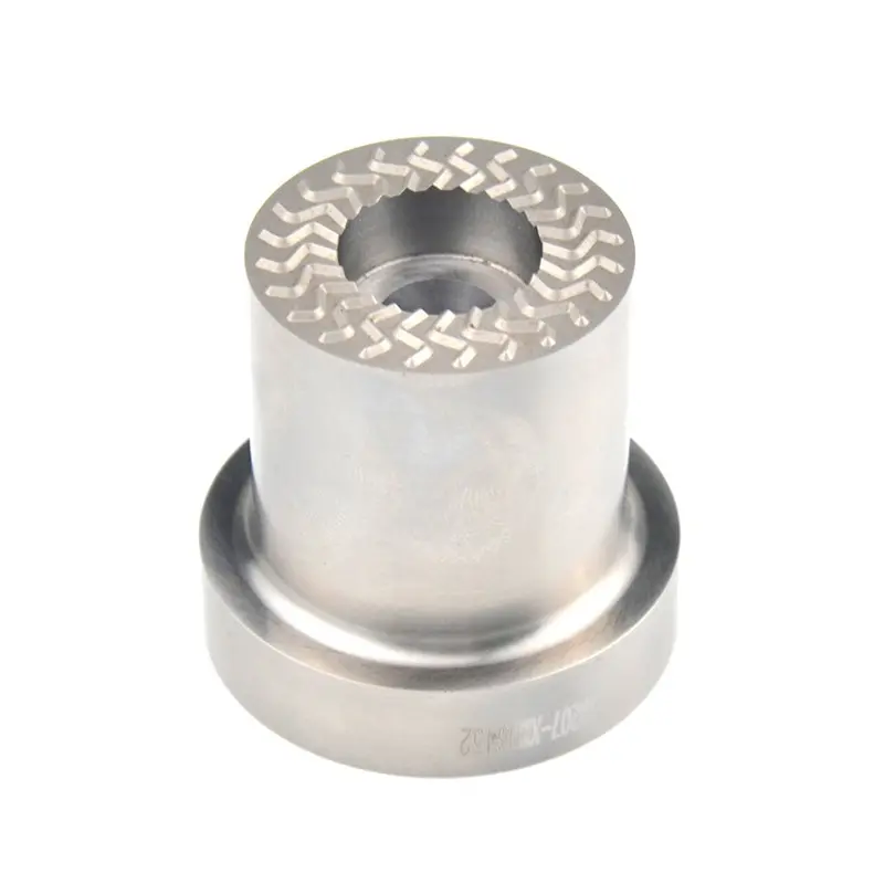 Precision machined cylindrical metal sleeve with a central bore and patterned top surface